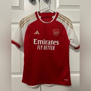 Size large youth with name saka and number 7 home jersey 23/24